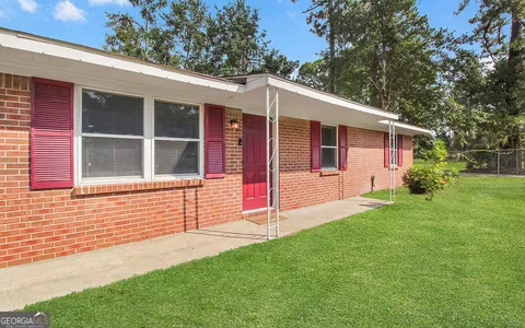 a balcony view with a garden