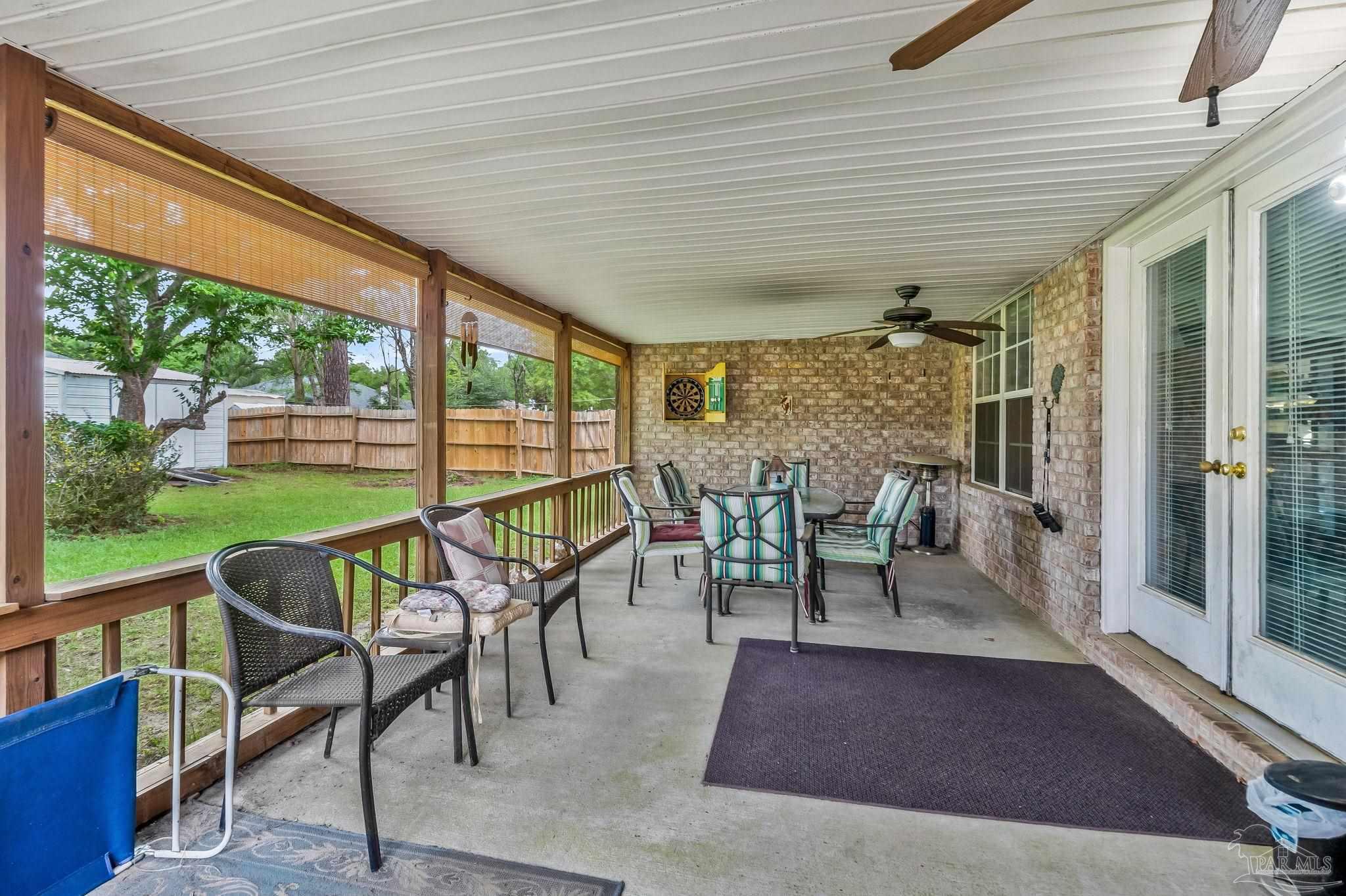 5691 Berrybrook Circle Pace, FL 32571 - Photo 17 of 22 a dining room with furniture and wooden floor