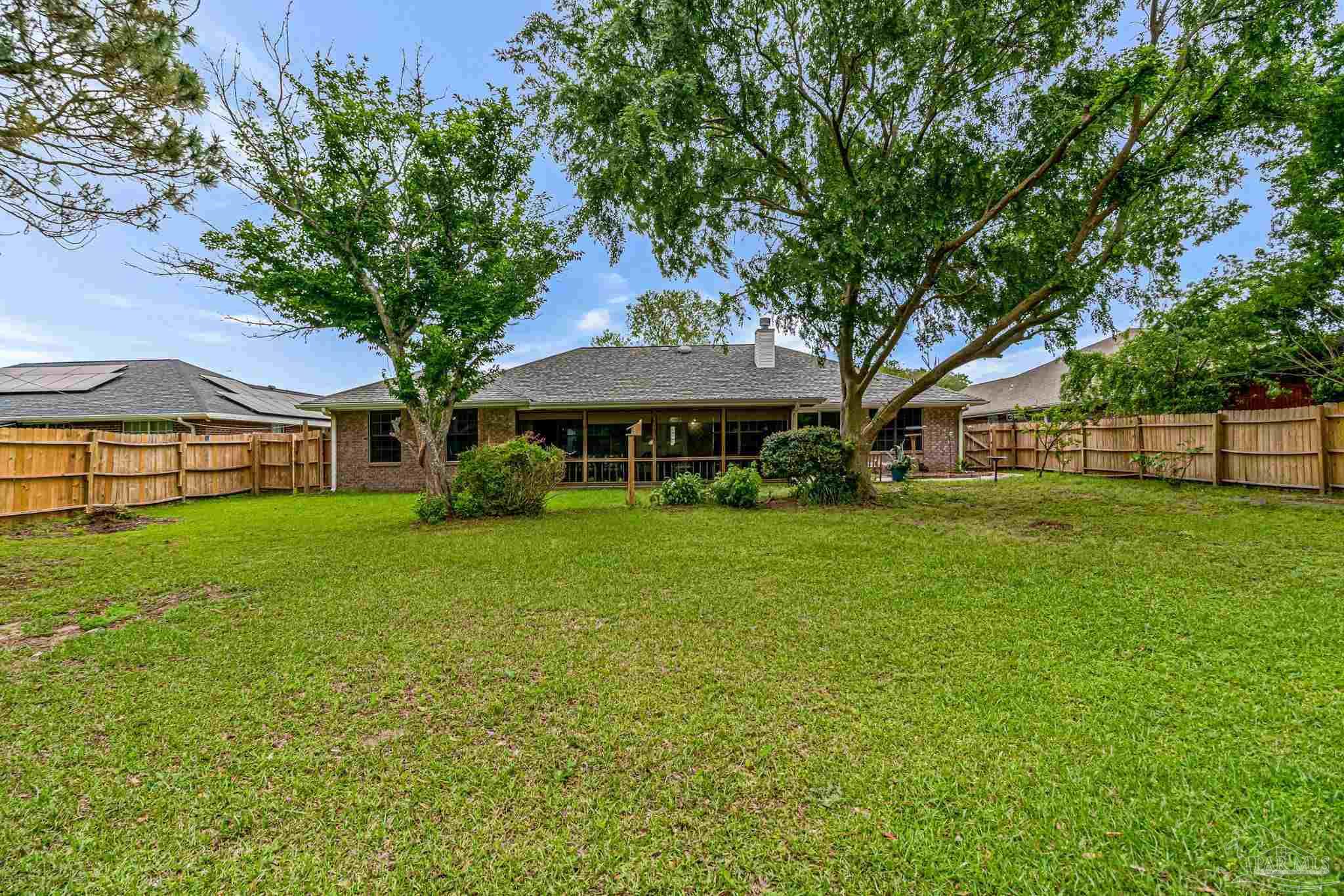 5691 Berrybrook Circle Pace, FL 32571 - Photo 21 of 22 a front view of a house with garden