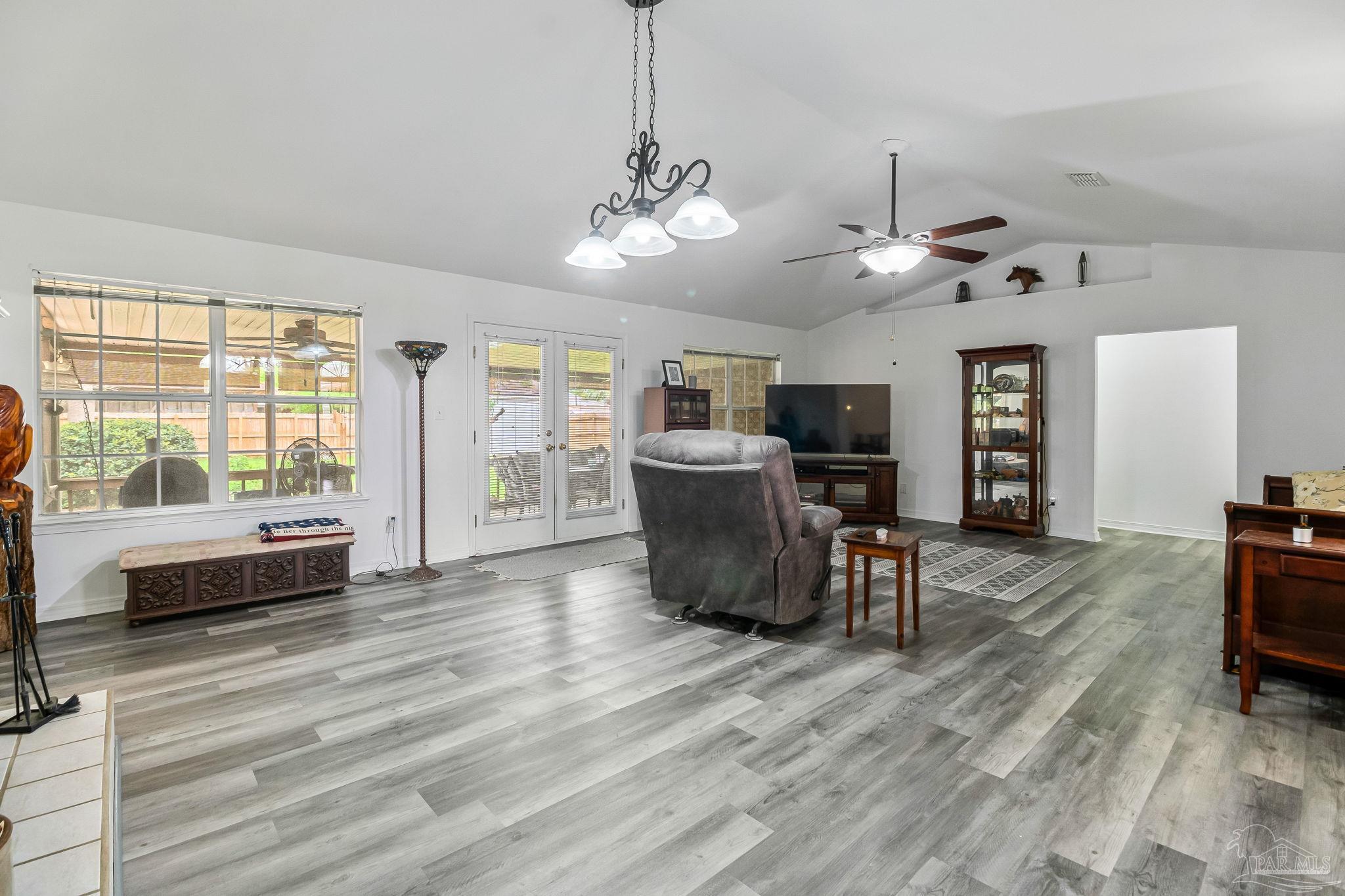 5691 Berrybrook Circle Pace, FL 32571 - Photo 10 of 22 a view of a livingroom with furniture window and wooden floor