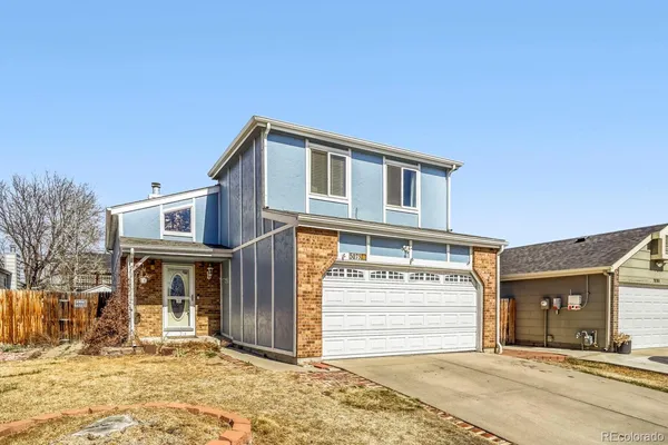 a front view of a house with a garage