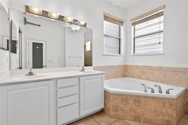 a bath tub sitting next to a window