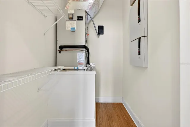 a view of a swimming pool with potted plants
