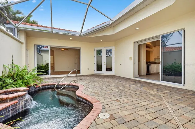 a room with pool table and windows