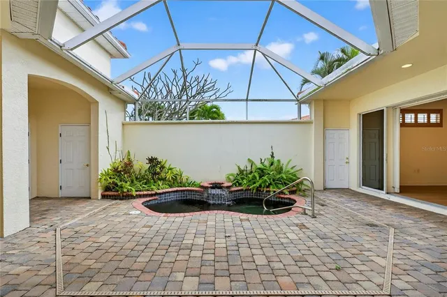 a view of a patio with swimming pool table and chairs