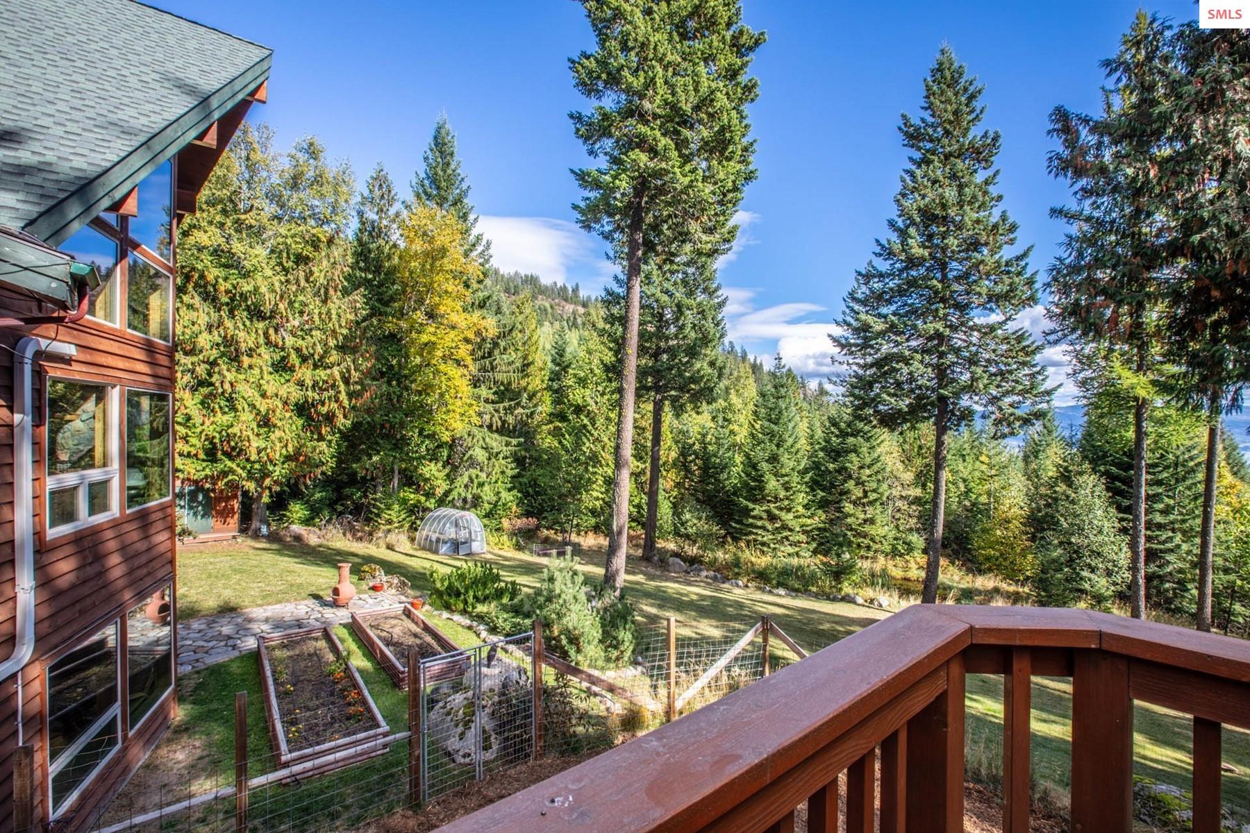 25 Inspiration Way Sandpoint, ID 83864 - Photo 60 of 76 Raised beds, green house, gentle sloping lawn, dog run
