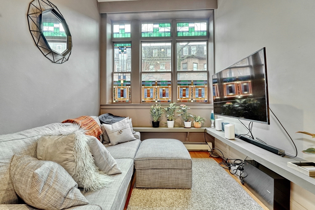 70 Clarendon Street, Unit 1 Boston, MA 02116 - Photo 1 of 19 a living room with furniture and a flat screen tv