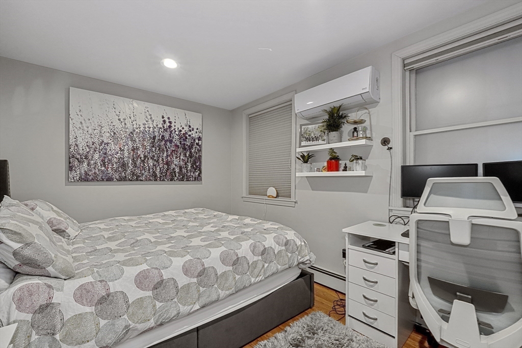 70 Clarendon Street, Unit 1 Boston, MA 02116 - Photo 11 of 19 a bedroom with a bed and a couch