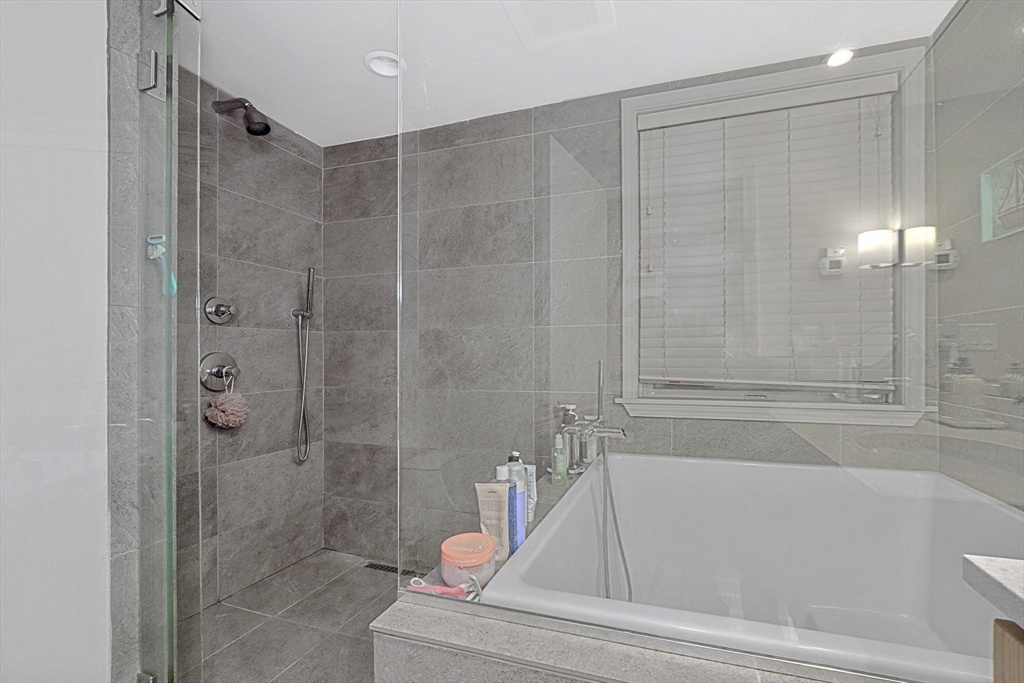 70 Clarendon Street, Unit 1 Boston, MA 02116 - Photo 14 of 19 a bathroom with a tub and shower