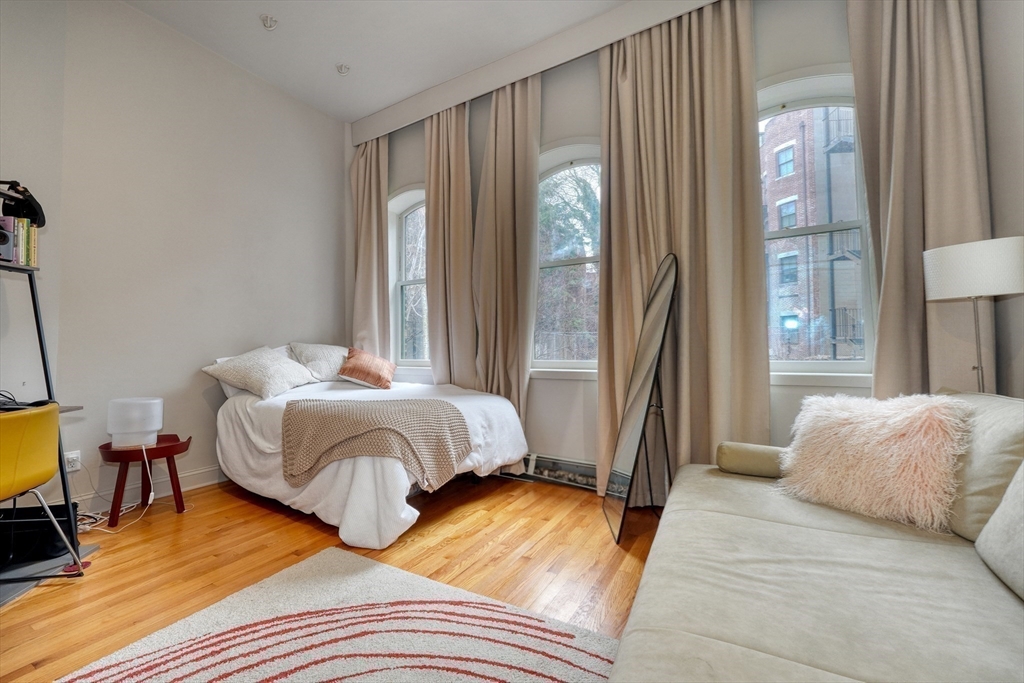 70 Clarendon Street, Unit 1 Boston, MA 02116 - Photo 7 of 19 a bedroom with a bed and a mirror