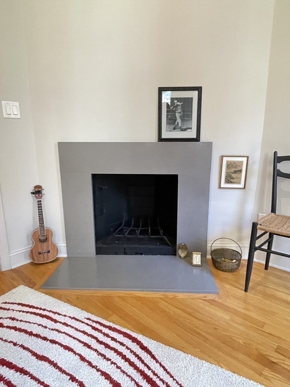 70 Clarendon Street, Unit 1 Boston, MA 02116 - Photo 8 of 19 a living room with furniture and a fireplace