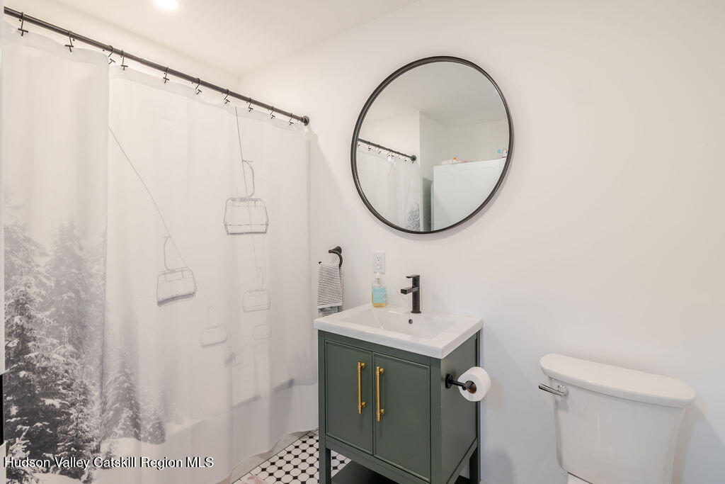 25 Catamount Road Hillsdale, NY 12529 - Photo 15 of 26 a bathroom with a sink a toilet and a mirror