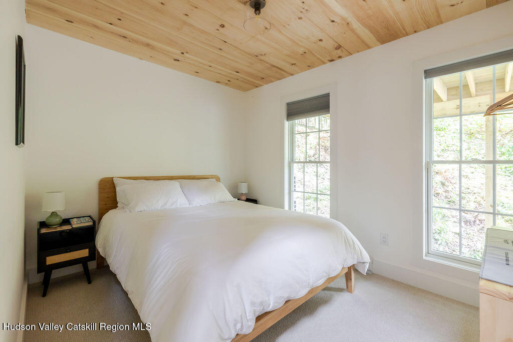 25 Catamount Road Hillsdale, NY 12529 - Photo 16 of 26 a bedroom with a bed and a window
