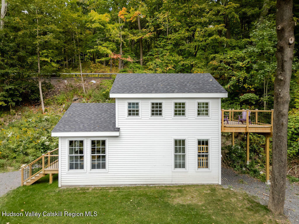 25 Catamount Road Hillsdale, NY 12529 - Photo 3 of 26 a front view of a house with a garden