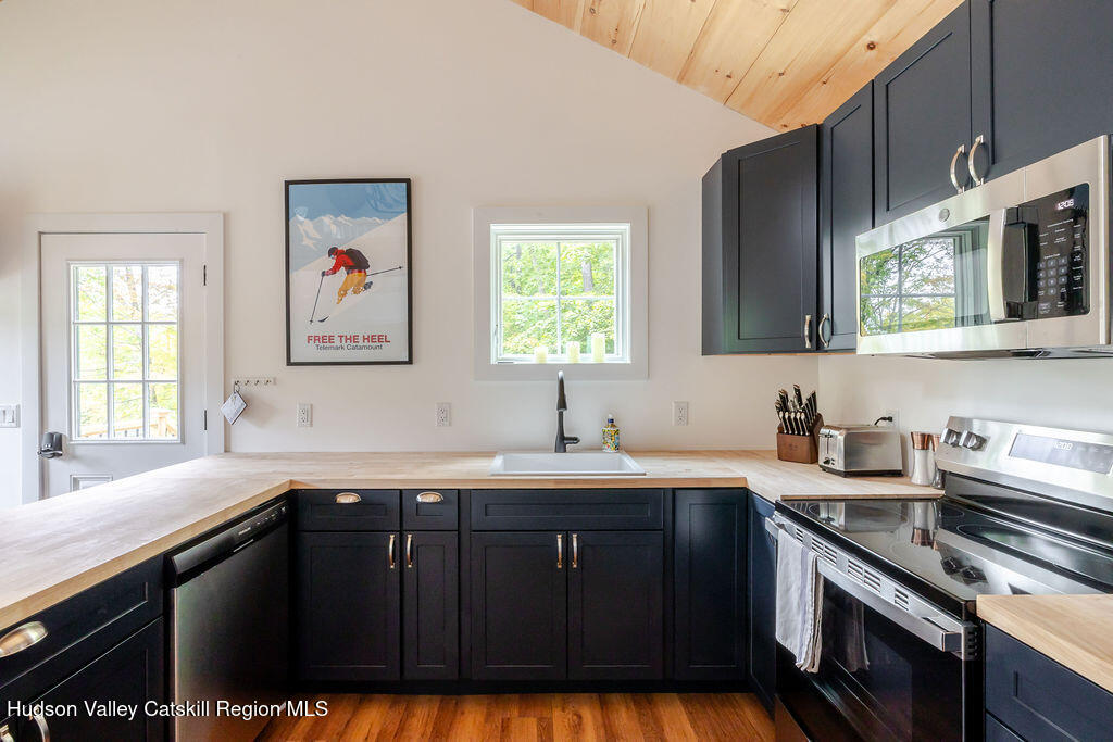 25 Catamount Road Hillsdale, NY 12529 - Photo 6 of 26 a kitchen with a sink stove and microwave