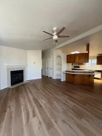 a view of a kitchen with a sink and a fireplace