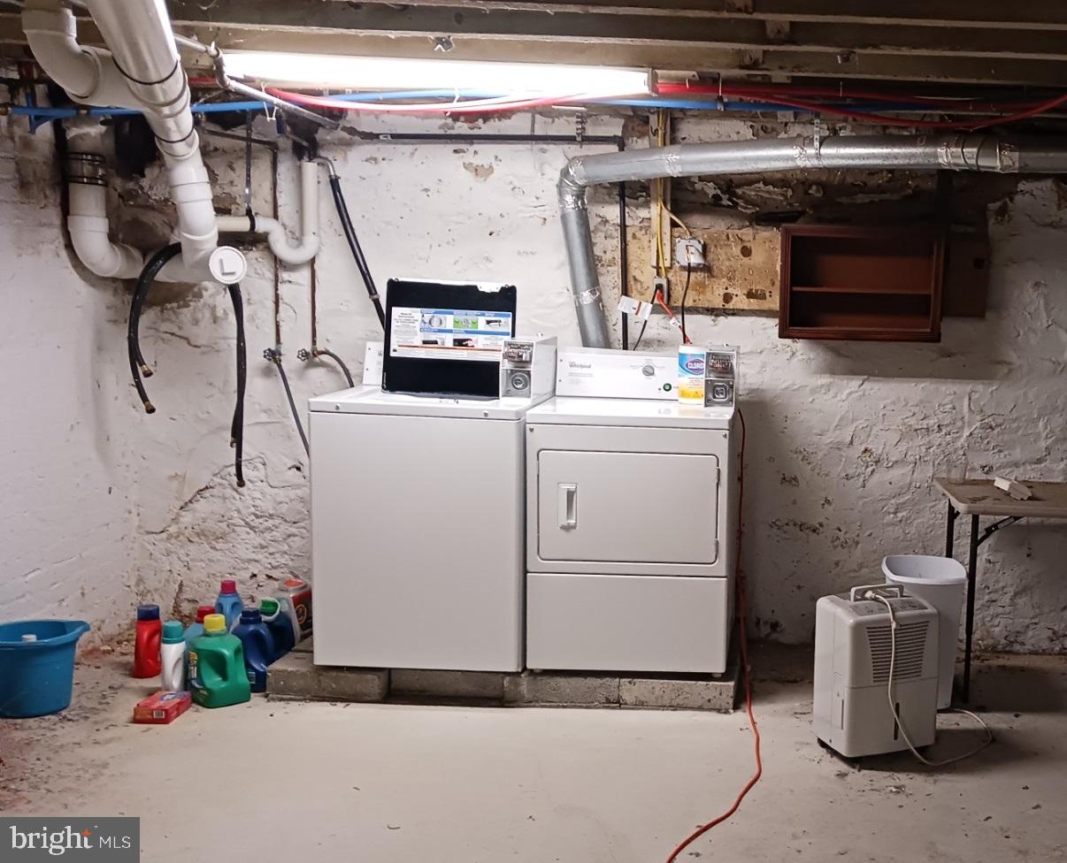58 Darby Road, Unit 1 Paoli, PA 19301 - Photo 12 of 16 a utility room with dryer and washer
