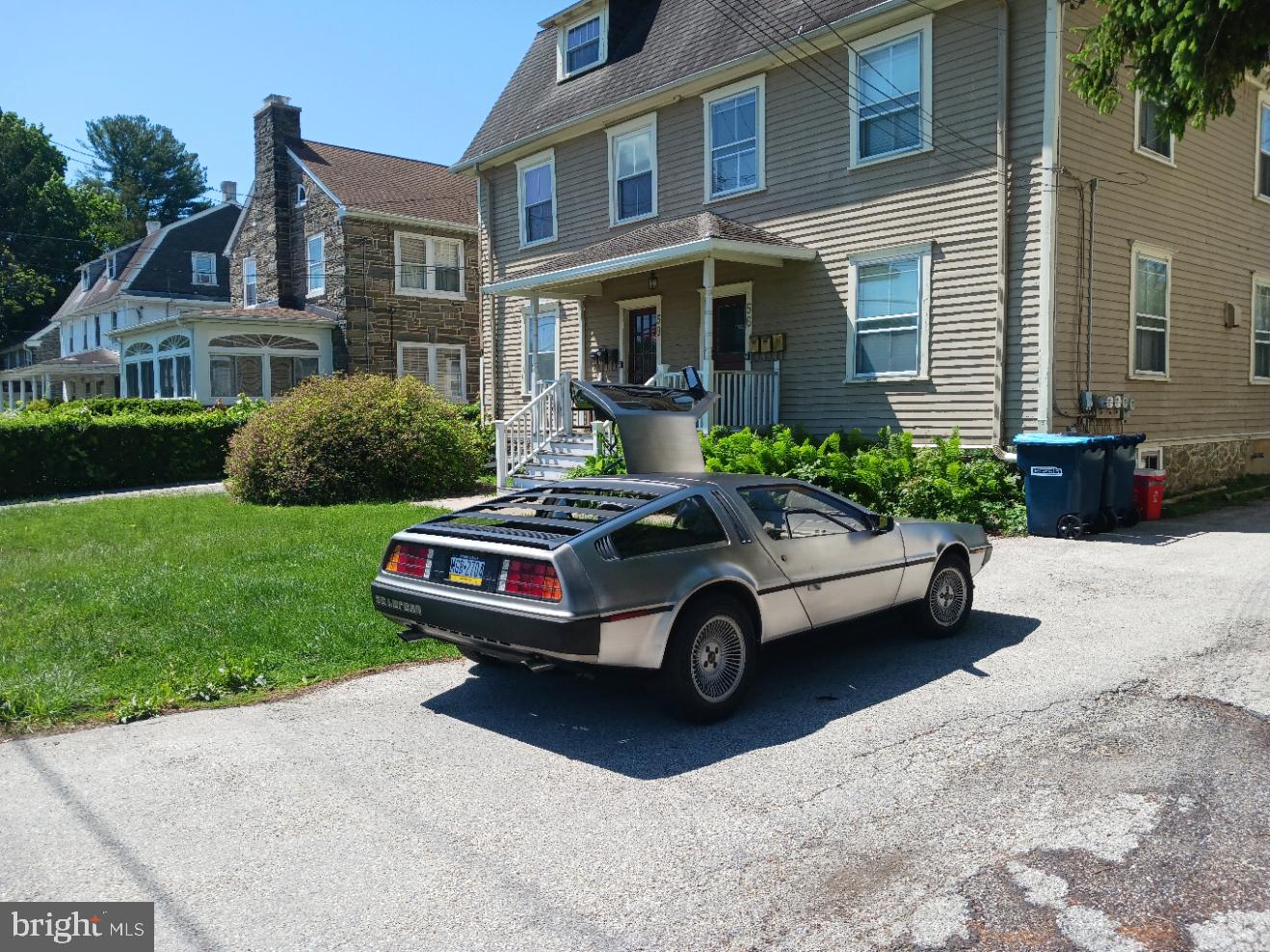 58 Darby Road, Unit 1 Paoli, PA 19301 - Photo 15 of 16 a car parked in front of a brick house