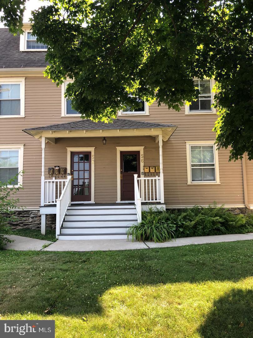 58 Darby Road, Unit 1 Paoli, PA 19301 - Photo 2 of 16 a front view of a house with a yard