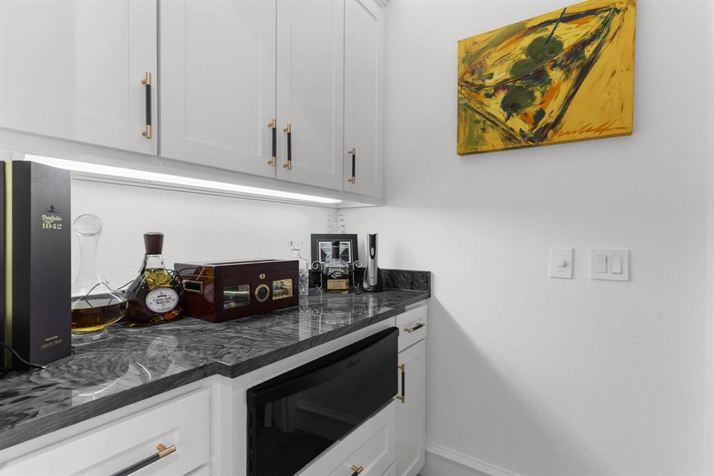 1307 Silverlake Road McKinney, TX 75072 - Photo 11 of 33 a kitchen with a sink and cabinets