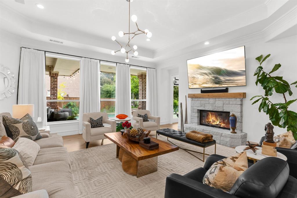 1307 Silverlake Road McKinney, TX 75072 - Photo 13 of 33 a living room with furniture fireplace and large windows