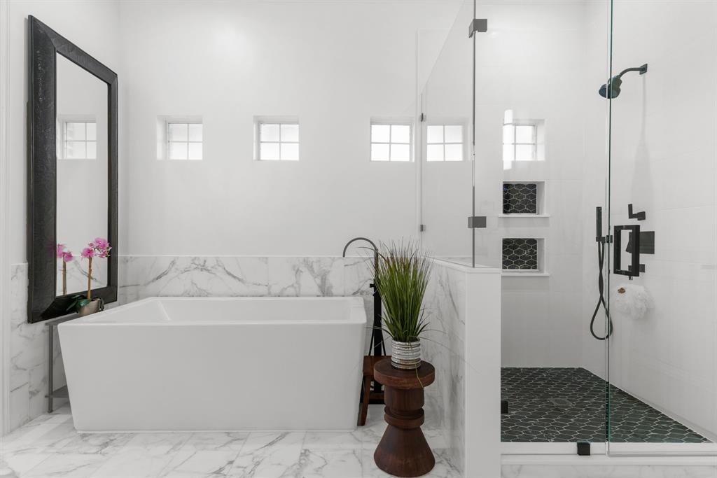 1307 Silverlake Road McKinney, TX 75072 - Photo 17 of 33 a bathroom with a bathtub and a shower