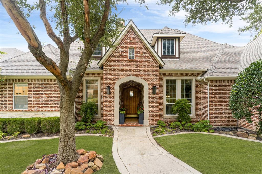 1307 Silverlake Road McKinney, TX 75072 - Photo 2 of 33 a front view of a house with garden