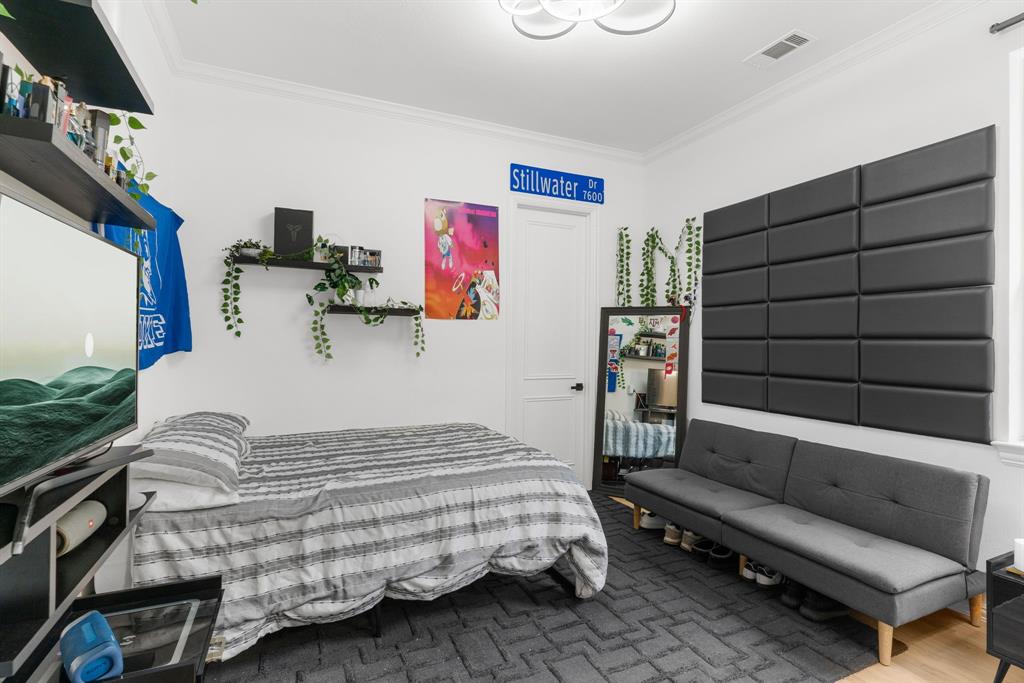 1307 Silverlake Road McKinney, TX 75072 - Photo 22 of 33 a bedroom with a bed and furniture