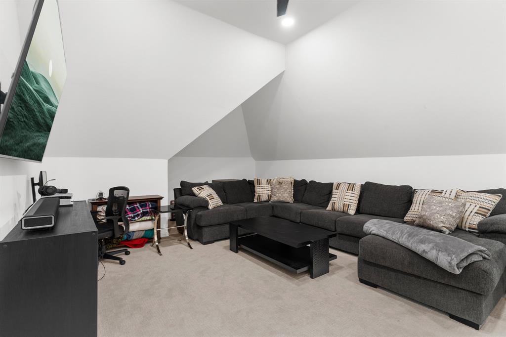 1307 Silverlake Road McKinney, TX 75072 - Photo 27 of 33 a living room with furniture and a flat screen tv