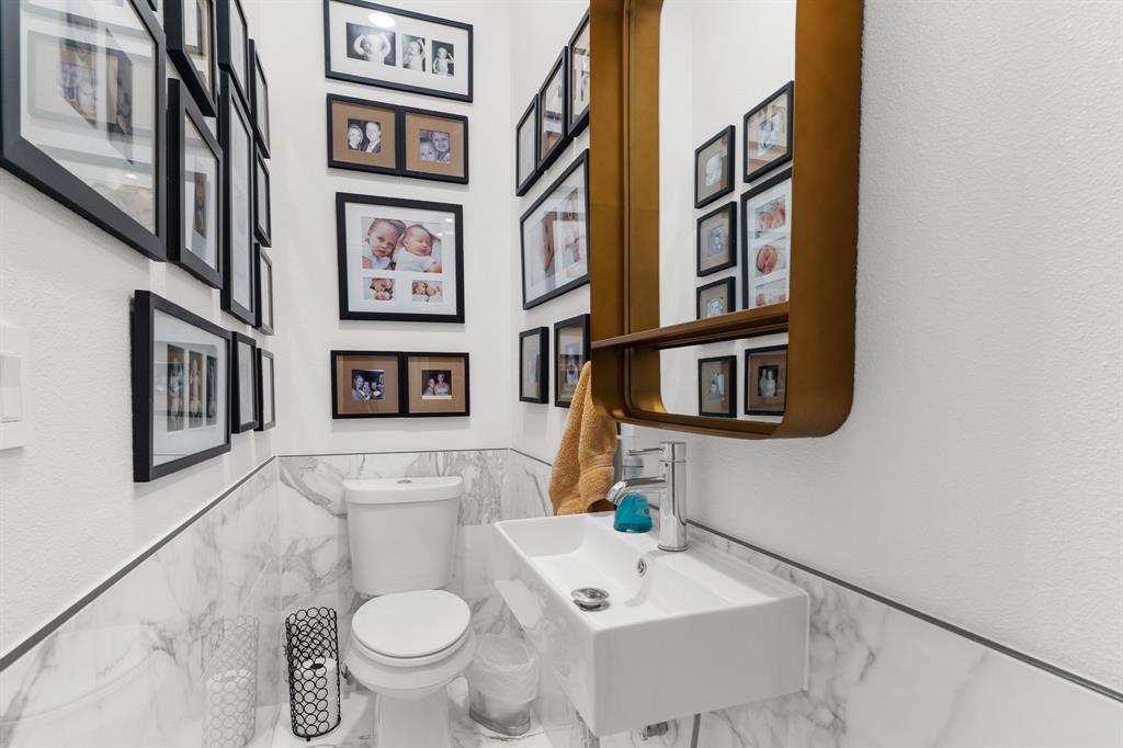 1307 Silverlake Road McKinney, TX 75072 - Photo 28 of 33 a bathroom with a toilet and a sink