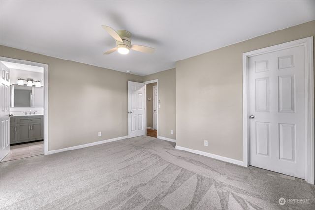 a bathroom with a double vanity sink toilet and shower