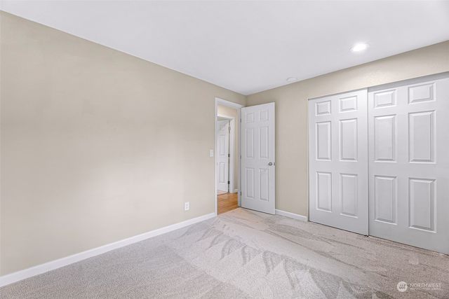 a view of balcony with wooden floor and fence