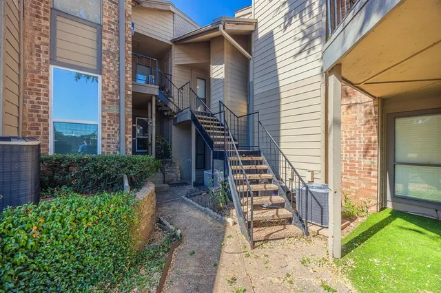 a view of a house with wooden floor and a lawn chairs