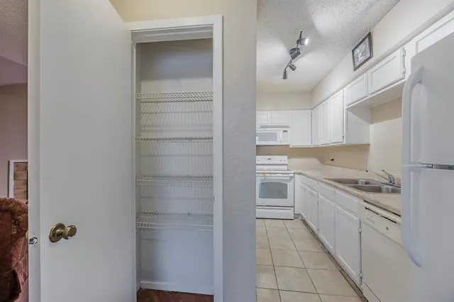 a bathroom with a shower and a sink