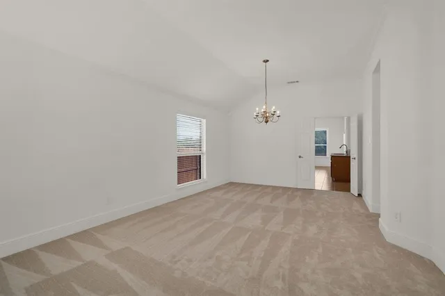 a view of a big room with windows and cabinet