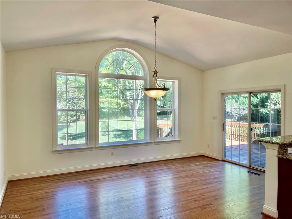 7798 Elizabeth Drive Oak Ridge, NC 27310 - Photo 15 of 26 Huge breakfast room with lots of natural light