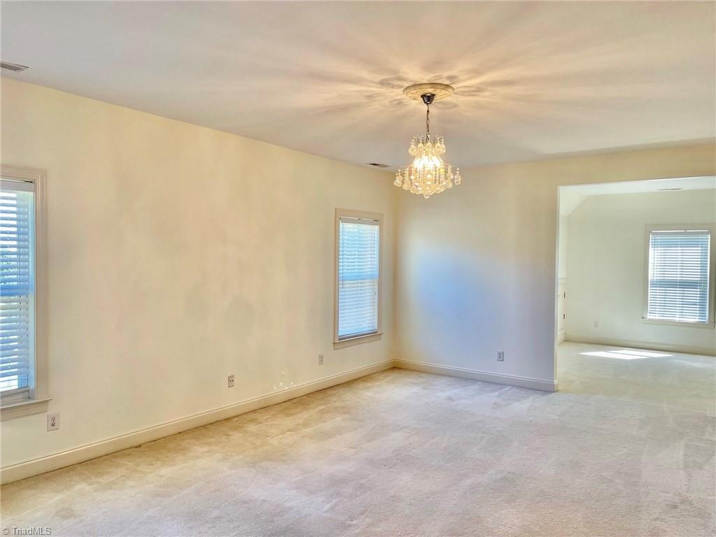 7798 Elizabeth Drive Oak Ridge, NC 27310 - Photo 18 of 26 Expansive primary suite with separate sitting area