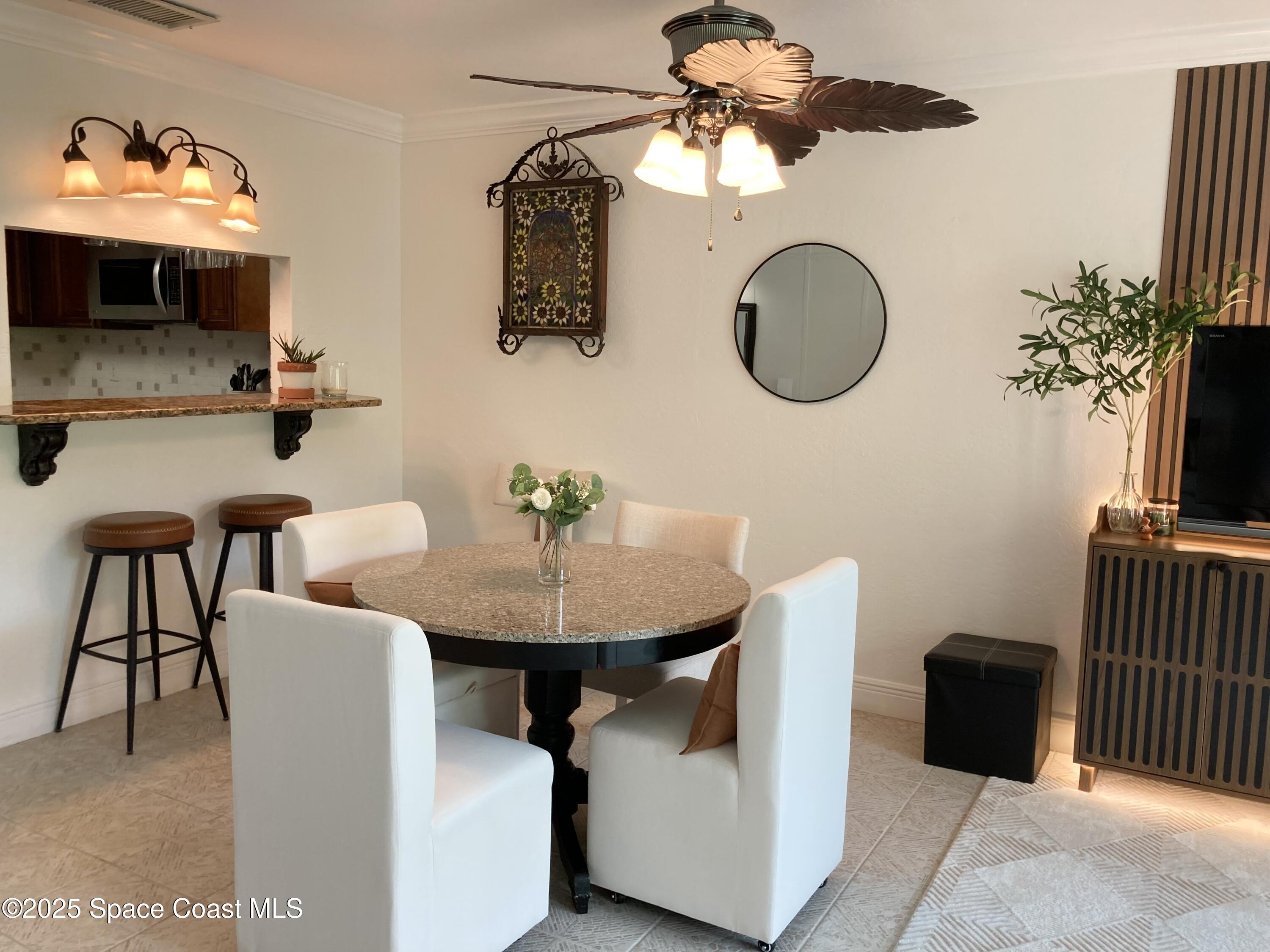 7 Cove Road Melbourne Beach, FL 32951 - Photo 12 of 55 a view of a dining room with furniture