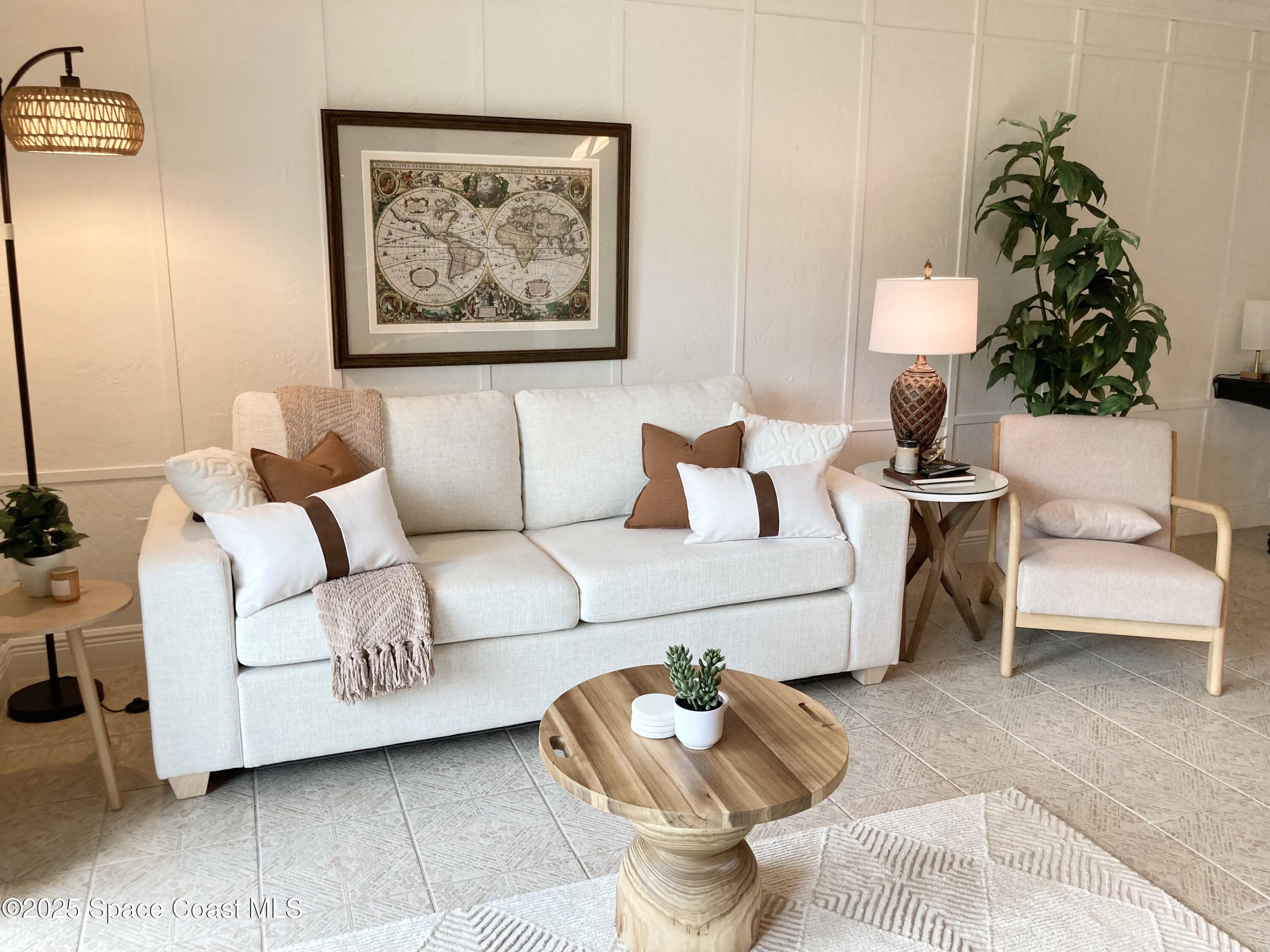 7 Cove Road Melbourne Beach, FL 32951 - Photo 15 of 55 a living room with furniture and a potted plant