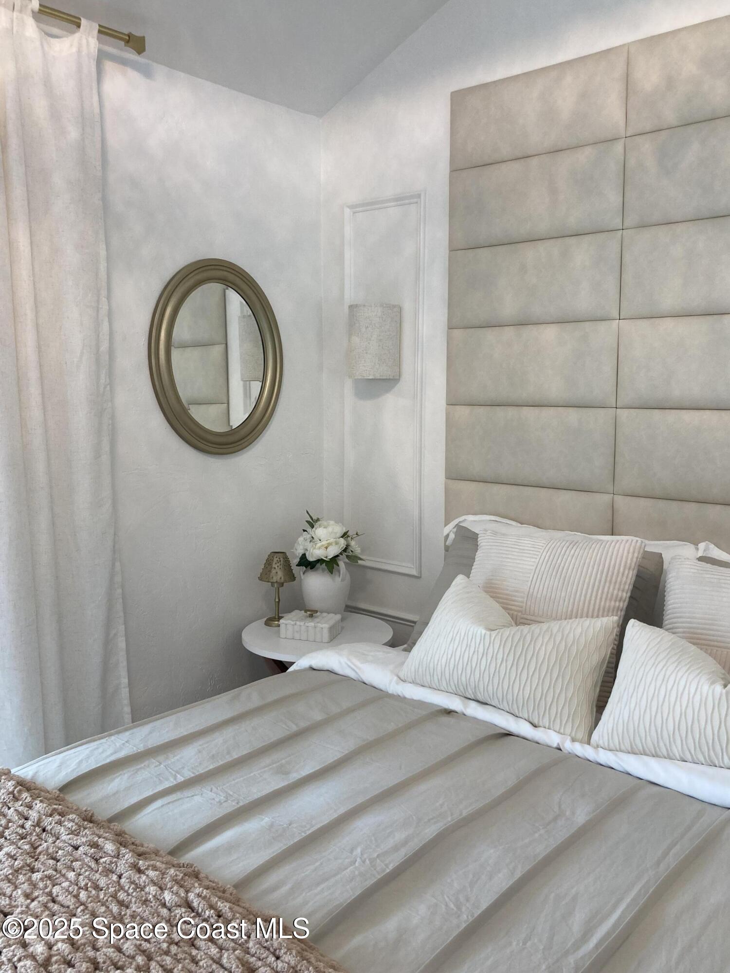 7 Cove Road Melbourne Beach, FL 32951 - Photo 23 of 55 a bedroom with a bed and a window