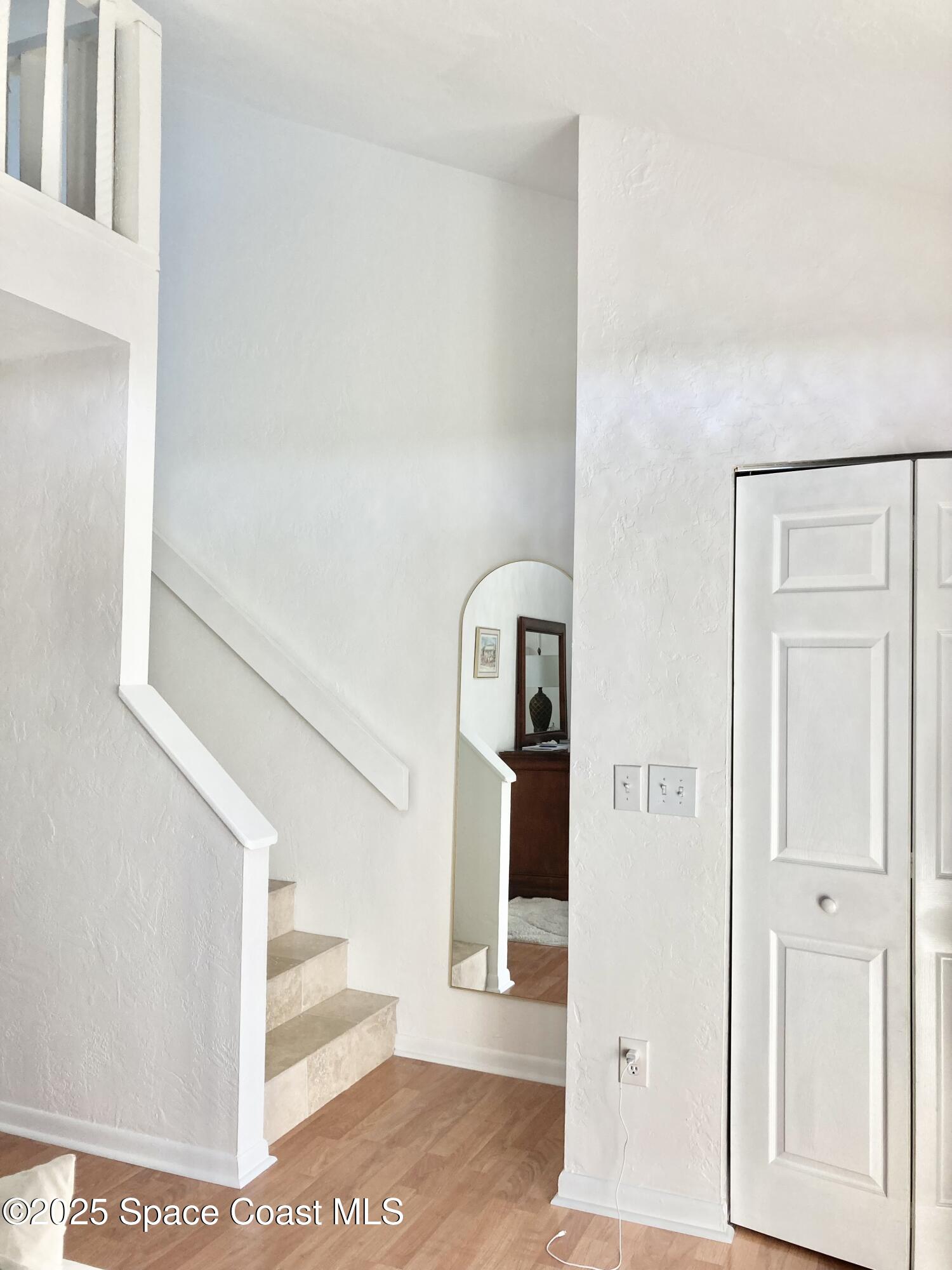 7 Cove Road Melbourne Beach, FL 32951 - Photo 29 of 55 a view of entryway and hall with wooden floor