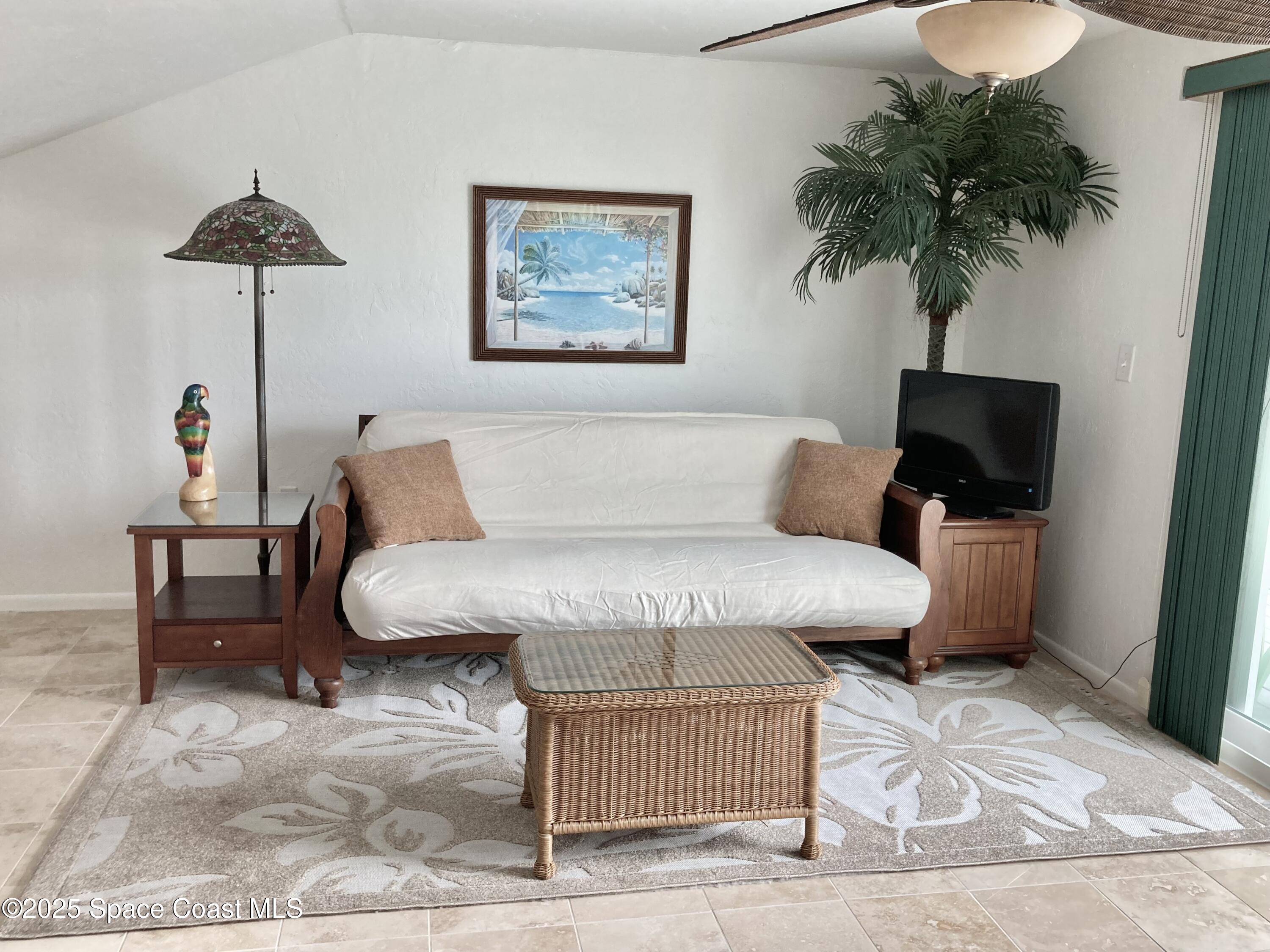 7 Cove Road Melbourne Beach, FL 32951 - Photo 34 of 55 a living room with furniture and a potted plant