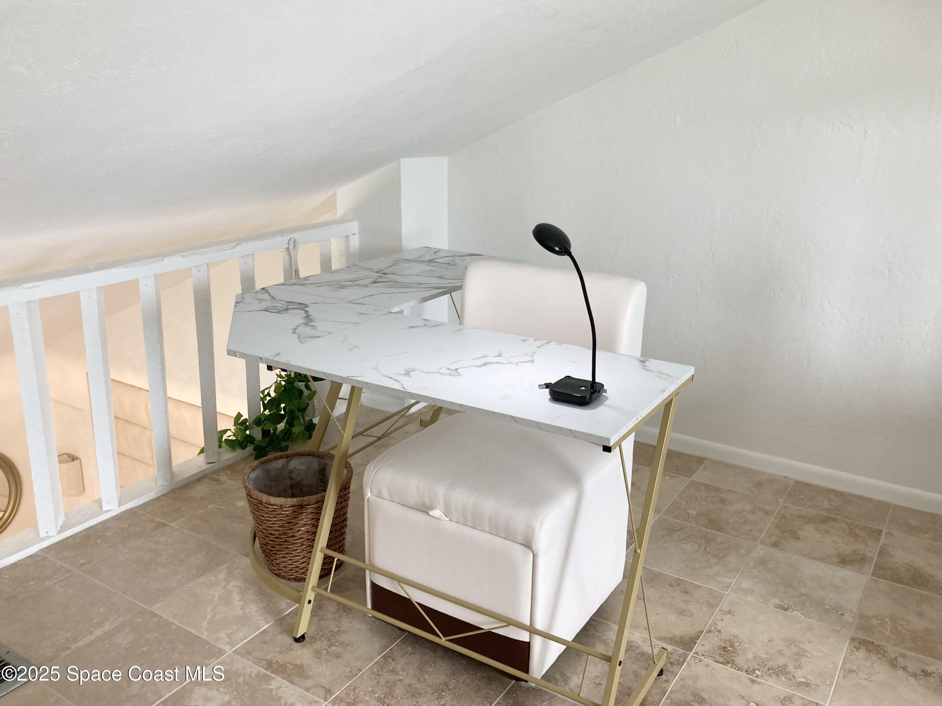 7 Cove Road Melbourne Beach, FL 32951 - Photo 35 of 55 a room with a table and chairs