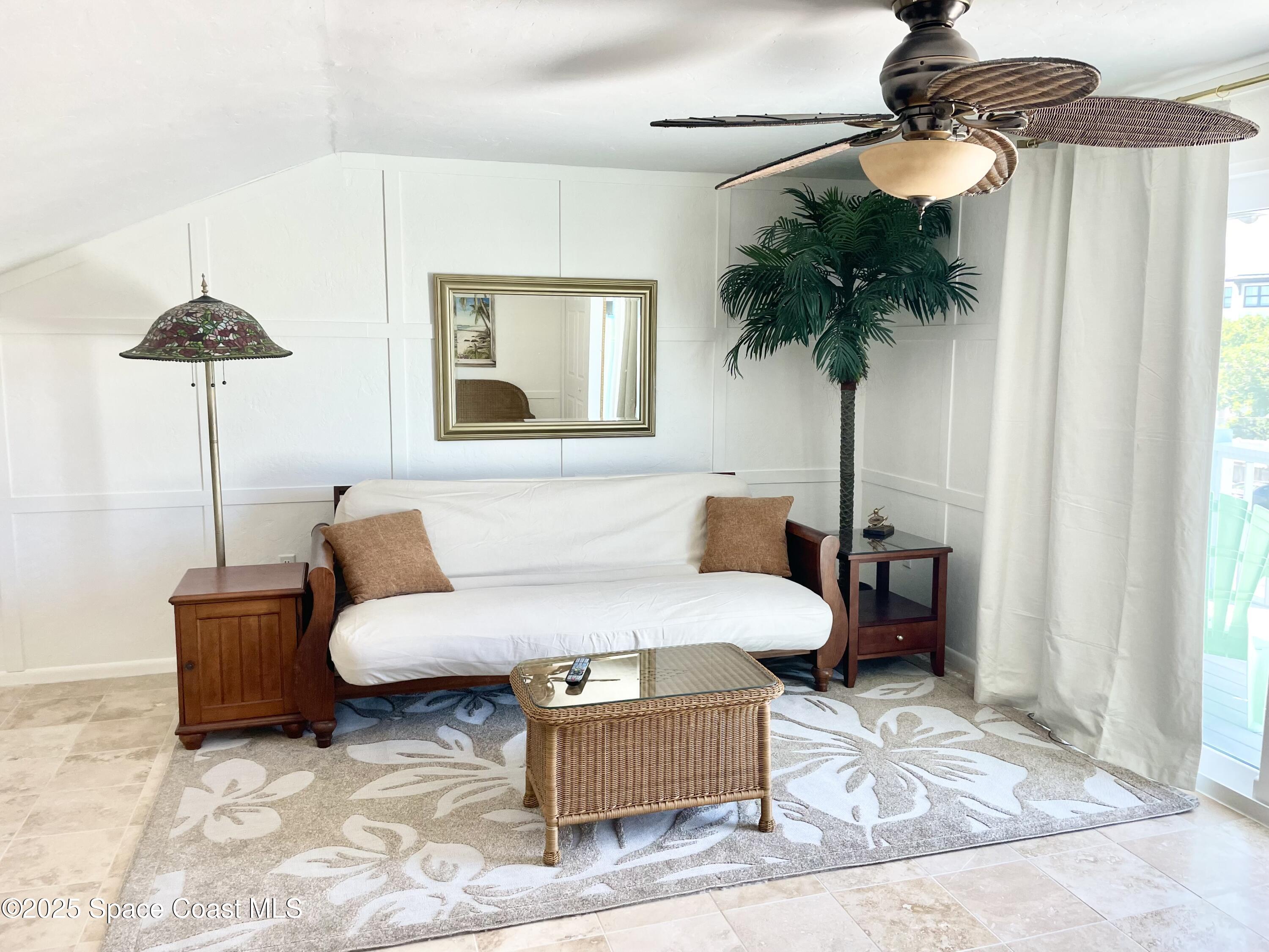 7 Cove Road Melbourne Beach, FL 32951 - Photo 36 of 55 a living room with furniture and a chandelier