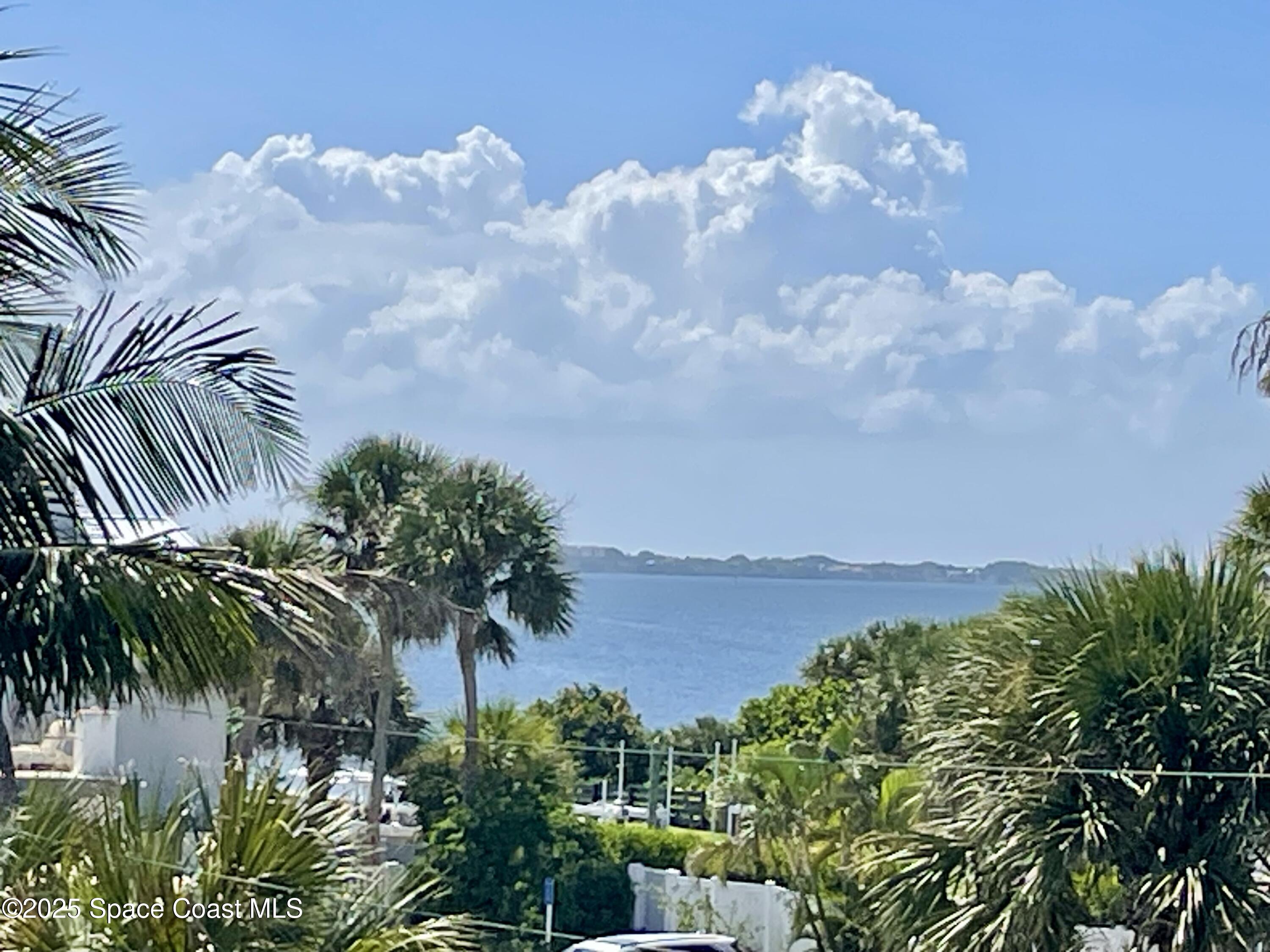 7 Cove Road Melbourne Beach, FL 32951 - Photo 42 of 55 a view of a yard and ocean view