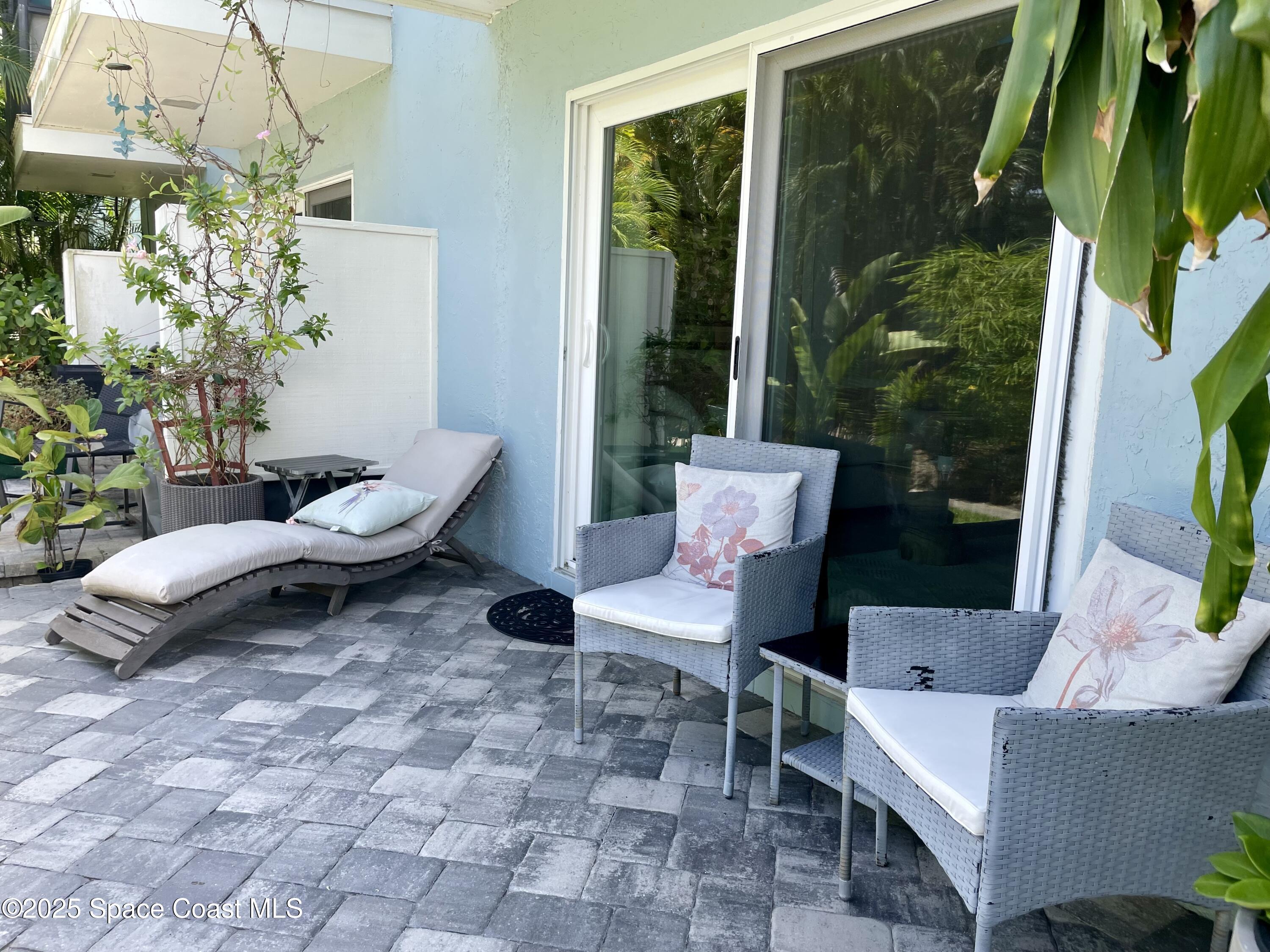 7 Cove Road Melbourne Beach, FL 32951 - Photo 46 of 55 a living room with furniture and a potted plant