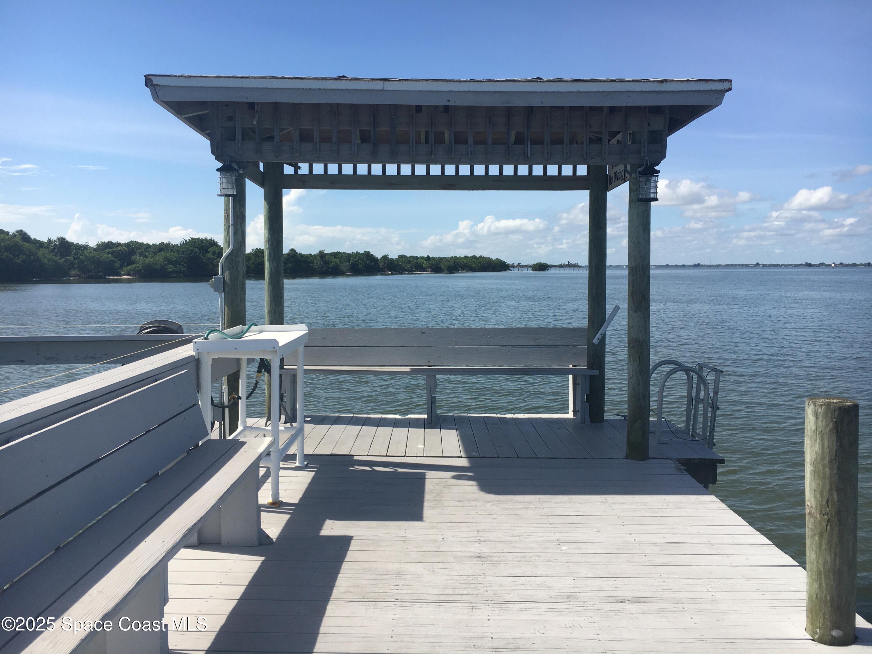 7 Cove Road Melbourne Beach, FL 32951 - Photo 47 of 55 a outdoor view with a sitting space