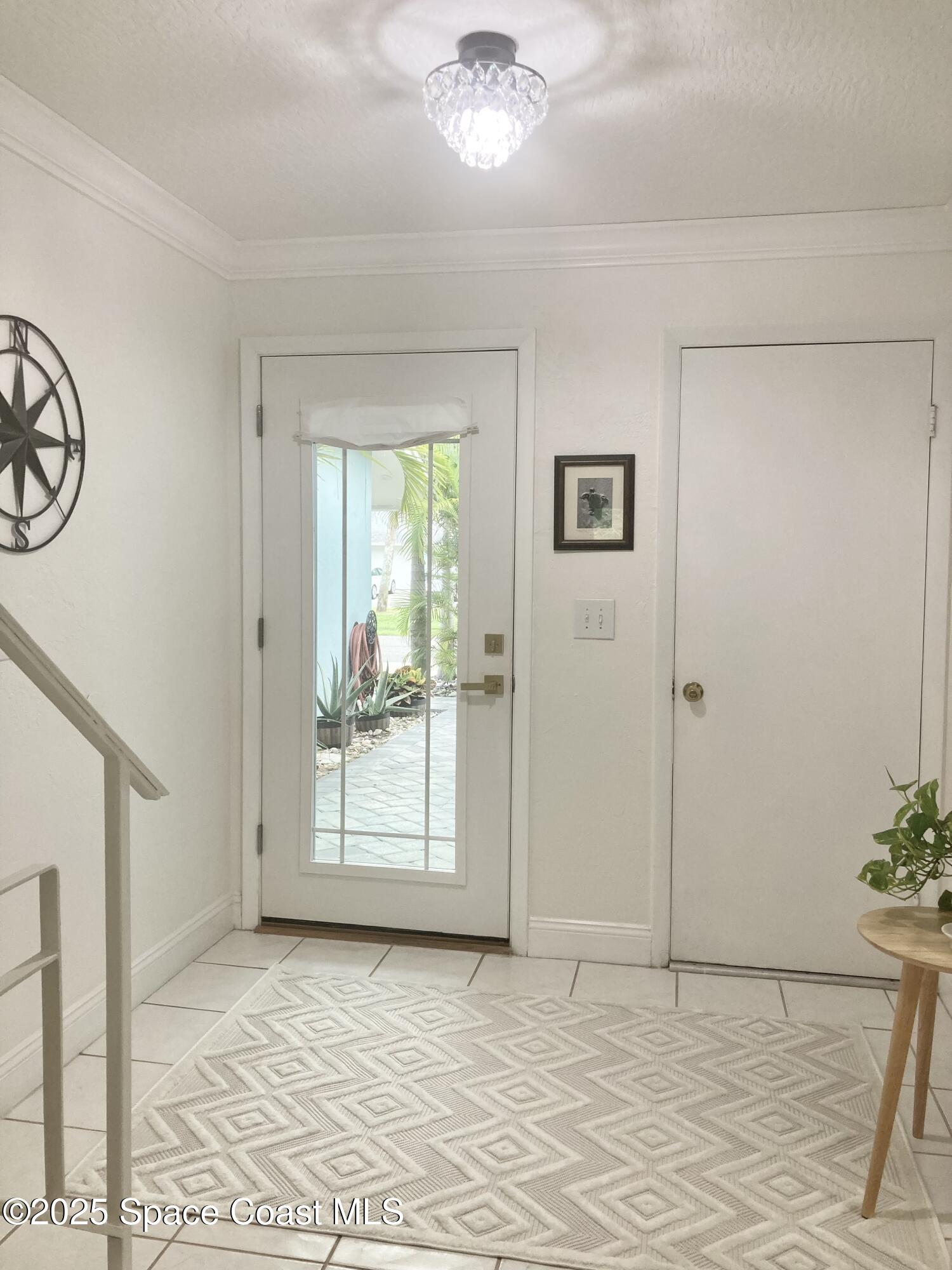 7 Cove Road Melbourne Beach, FL 32951 - Photo 5 of 55 a view of an empty room with a window