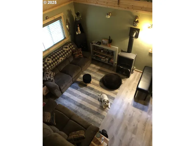 a view of storage and utility room with a window