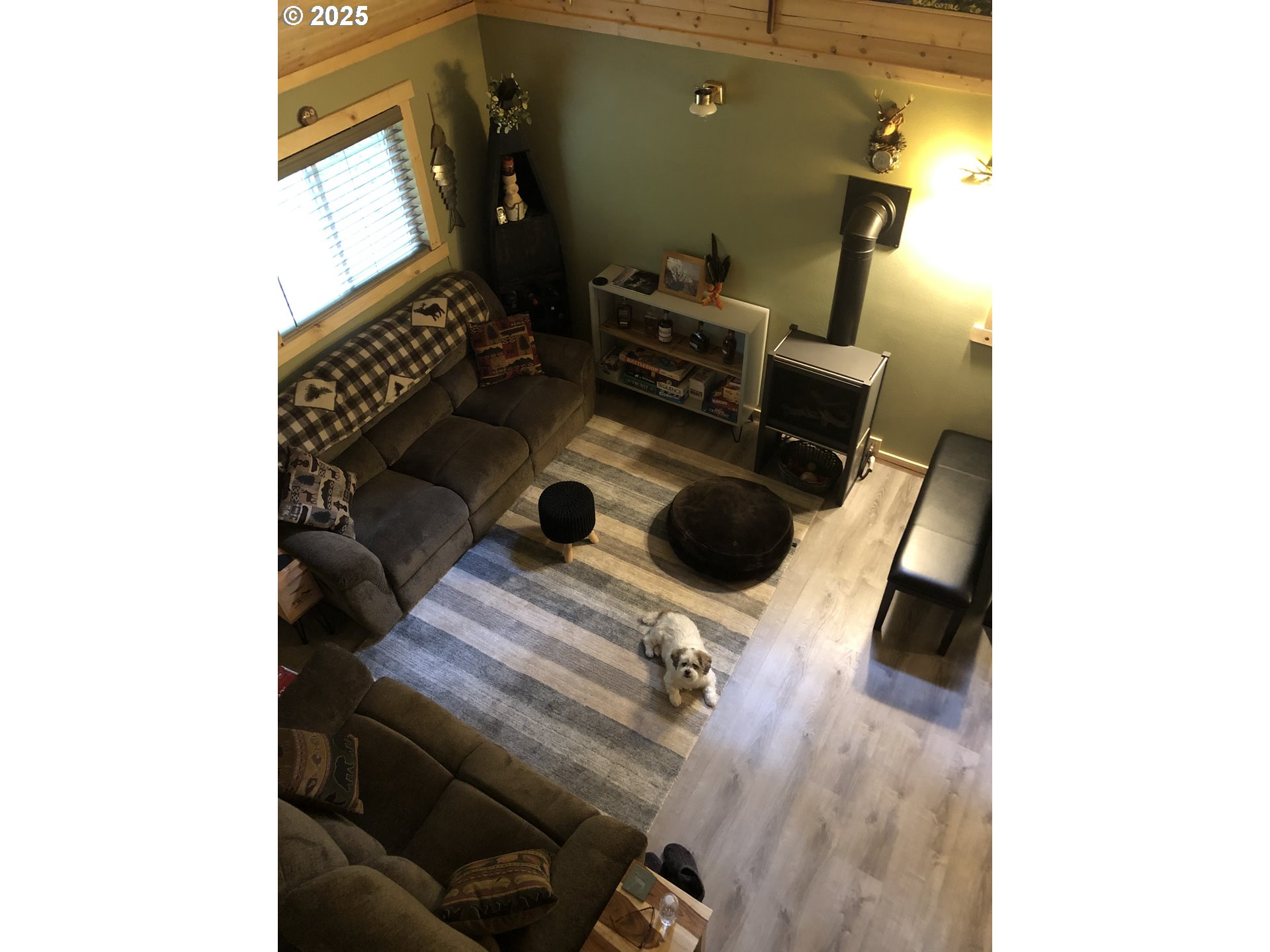 a view of storage and utility room with a window